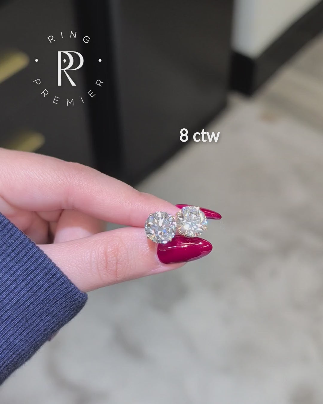 Geneva 4-prong basket round lab-grown diamond stud earrings, 8 ct tw pair in yellow gold shown held in hand