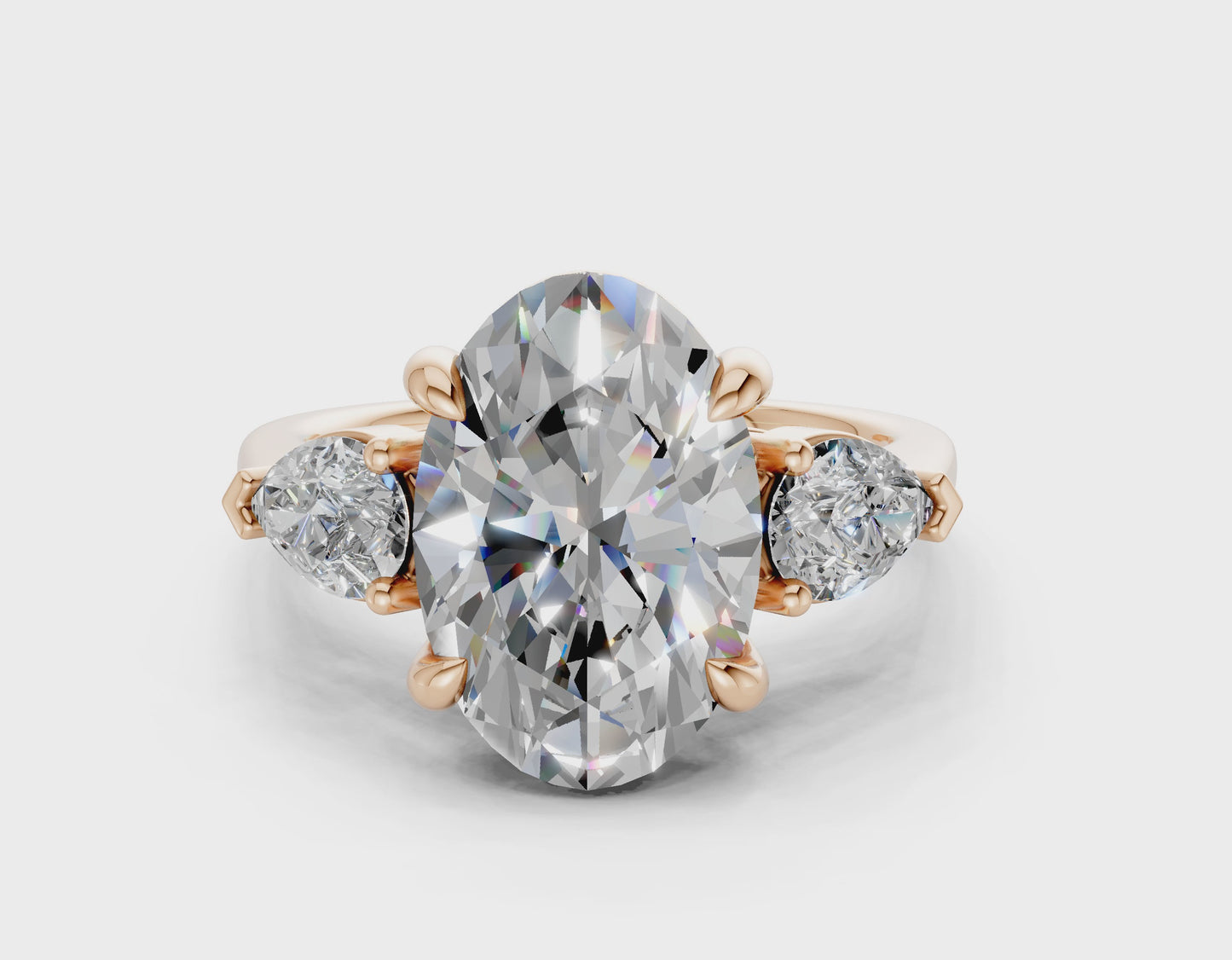 The Vara Three-Stone — 4.00ct Oval E VS1  with Pear Side Stones