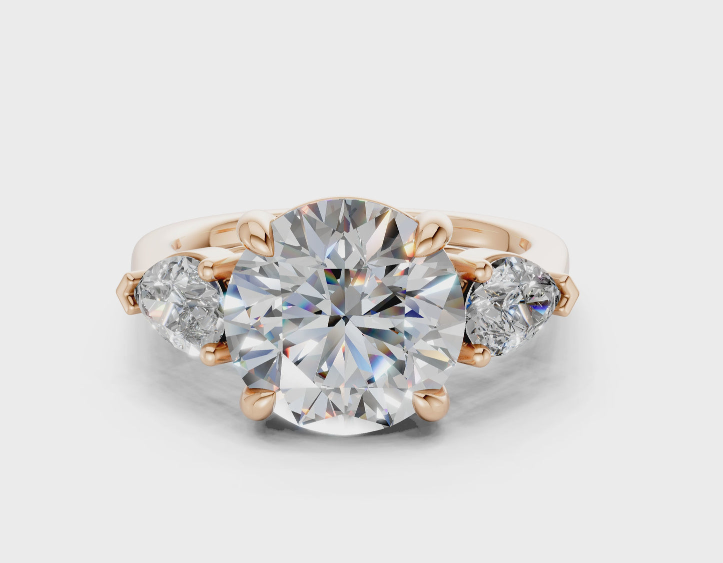 The Vara Three-Stone — 5.00ct Round E VS1  with Pear Side Stones