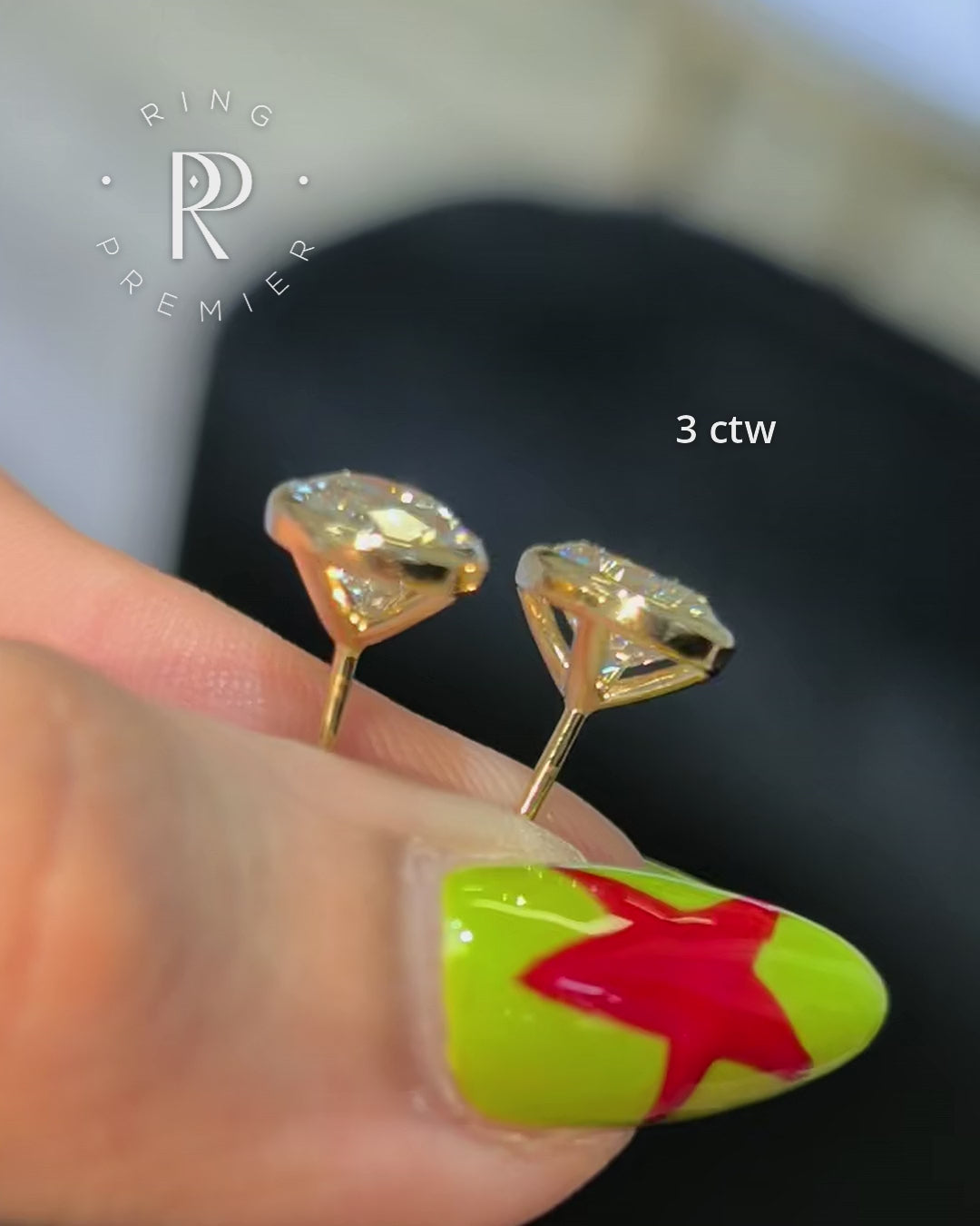 Bezel Set Martini Oval 3 carat (3 ct tw) lab-grown diamond stud earrings in yellow gold, shown held in hand with side profile of the martini setting