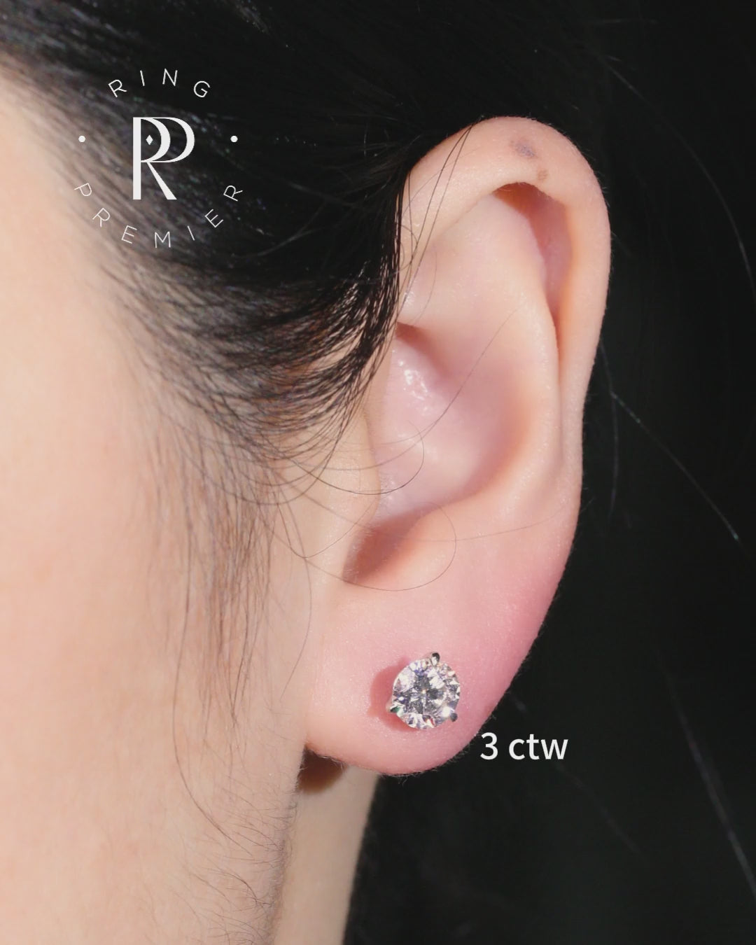 Florence 3 carat (3 ct tw) round lab-grown diamond stud earring in a 3-prong martini setting, worn on the ear to show real size